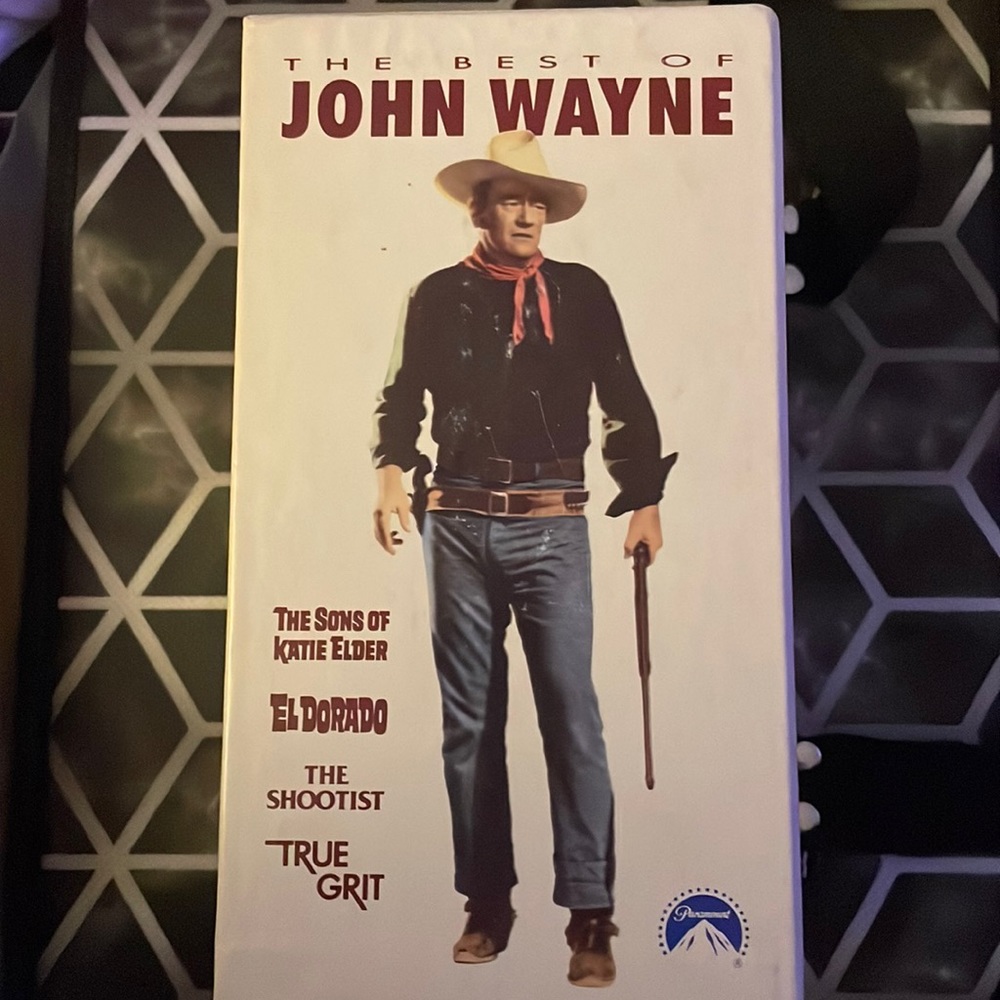 VHS Collection of John Wayne movies. 3 have never been opened. McLintock opened.